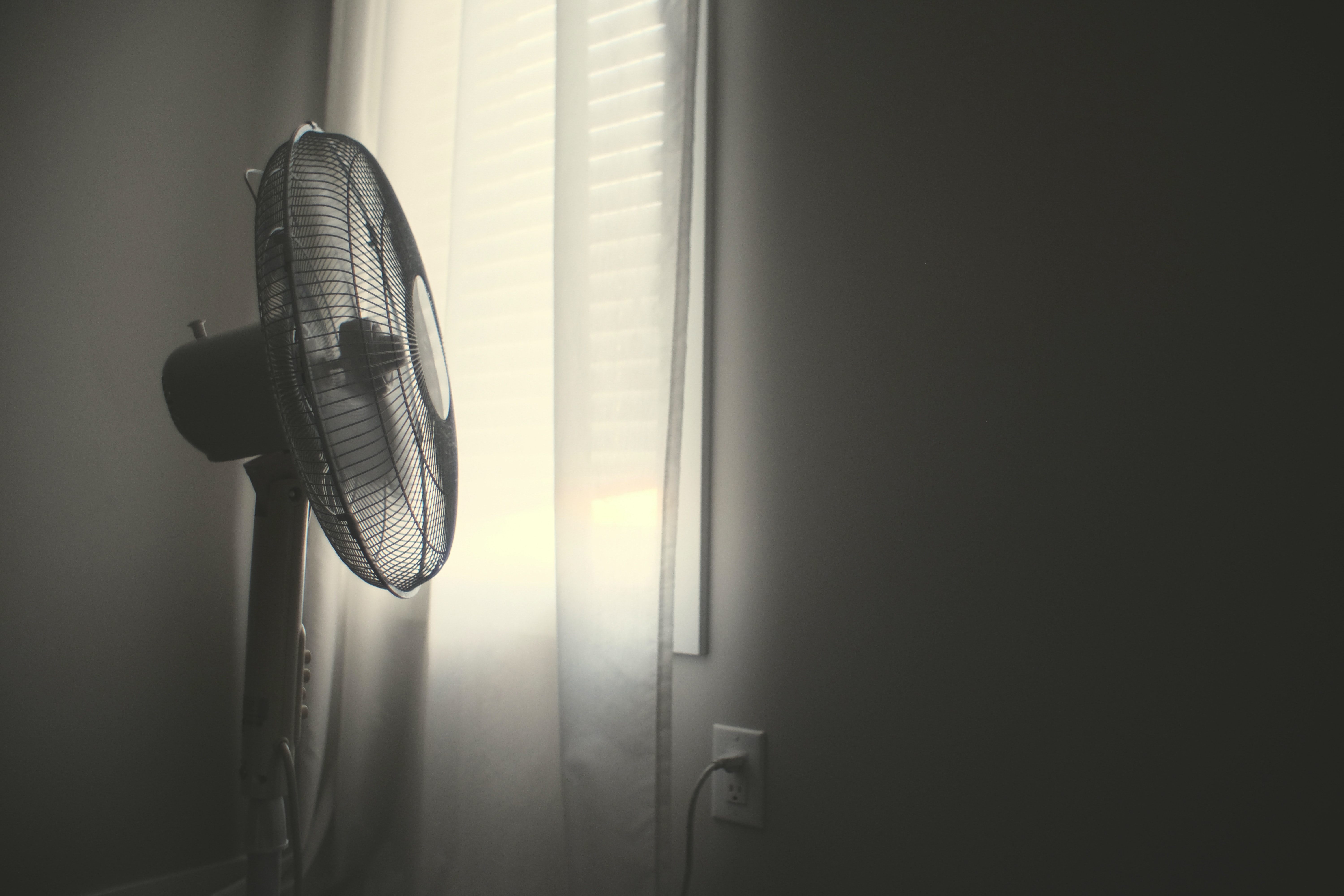 A fan positioned so it appears that it looks out of a window